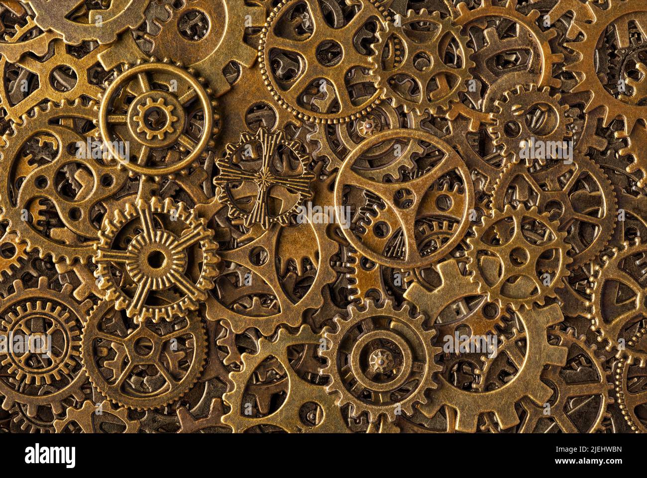 Big group of bronze cogwheels, abstract retro-style industrial