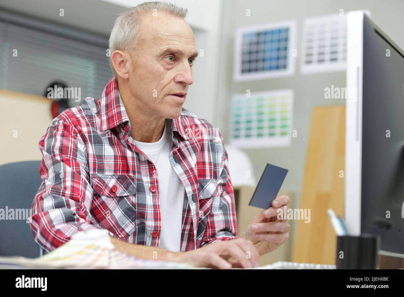 mature man with color swatches Stock Photo - Alamy