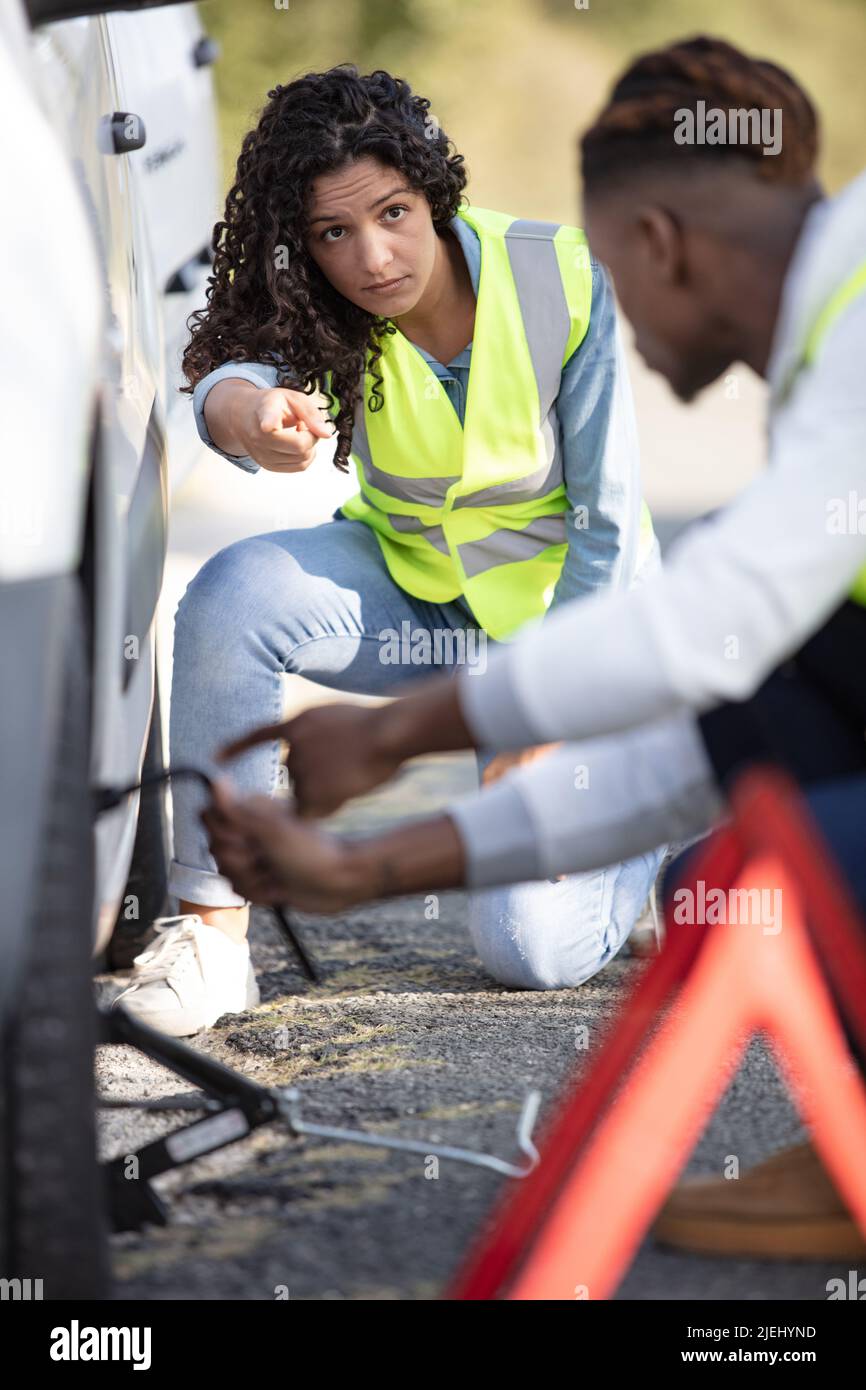despair couple waiting for help after engine breakdown Stock Photo - Alamy