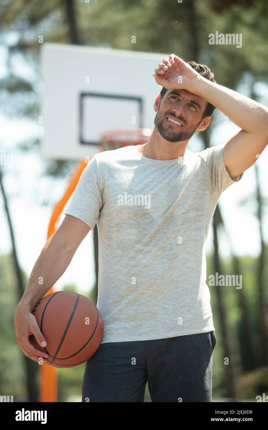 basketball player is tired from playing Stock Photo Alamy