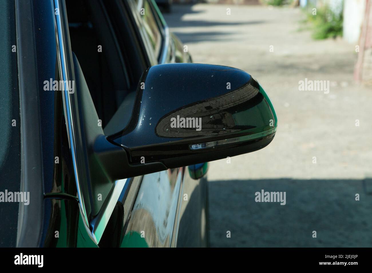 AUDI Q3 in black. luxury crossover Audi Q3. Side mirror view