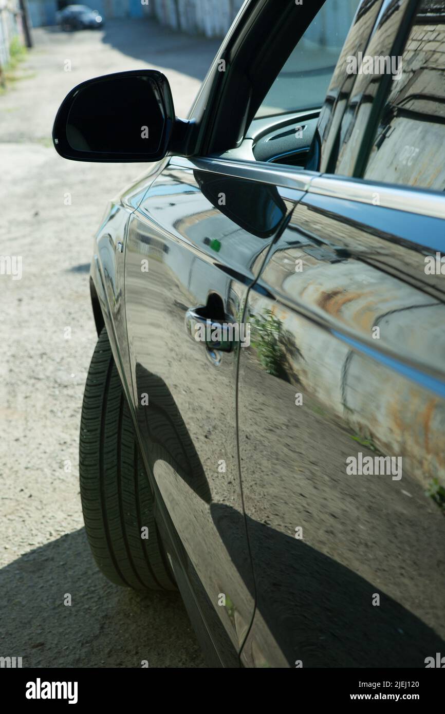 AUDI Q3 in black. luxury crossover Audi Q3. Side mirror view