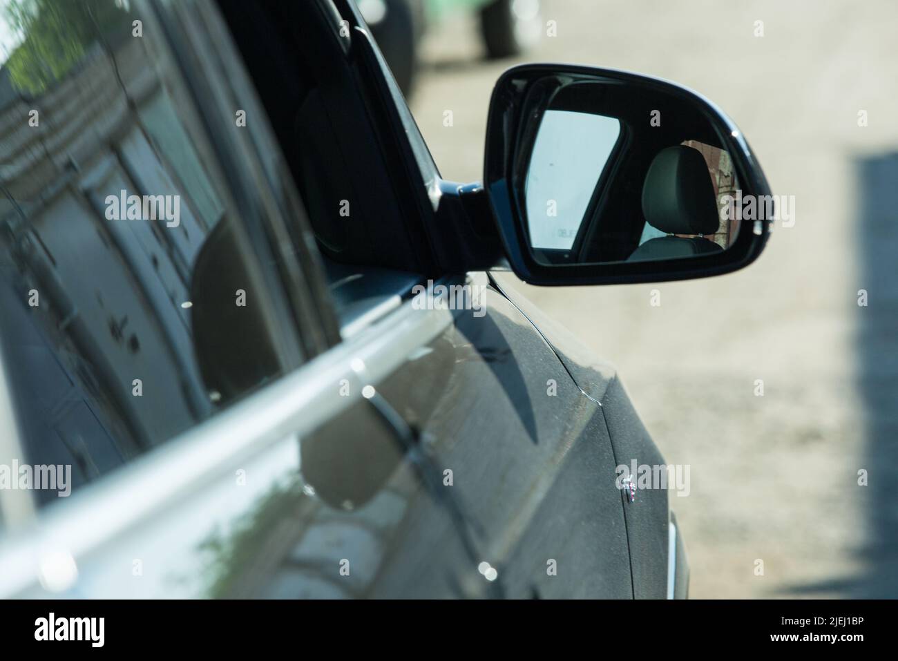 AUDI Q3 in black. luxury crossover Audi Q3. Side mirror view