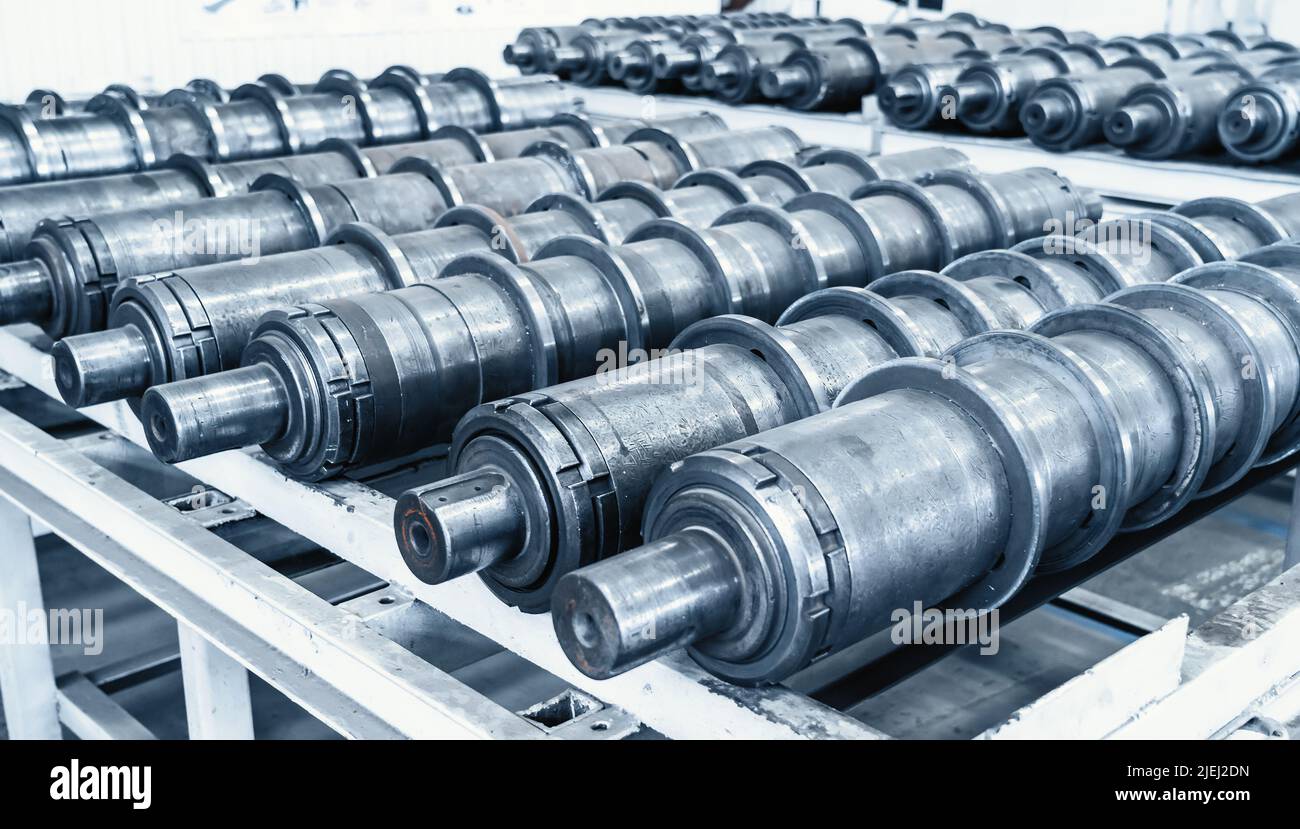 Plant for production of agricultural machinery. Metal cylindrical parts for combines or tractors. Stock Photo