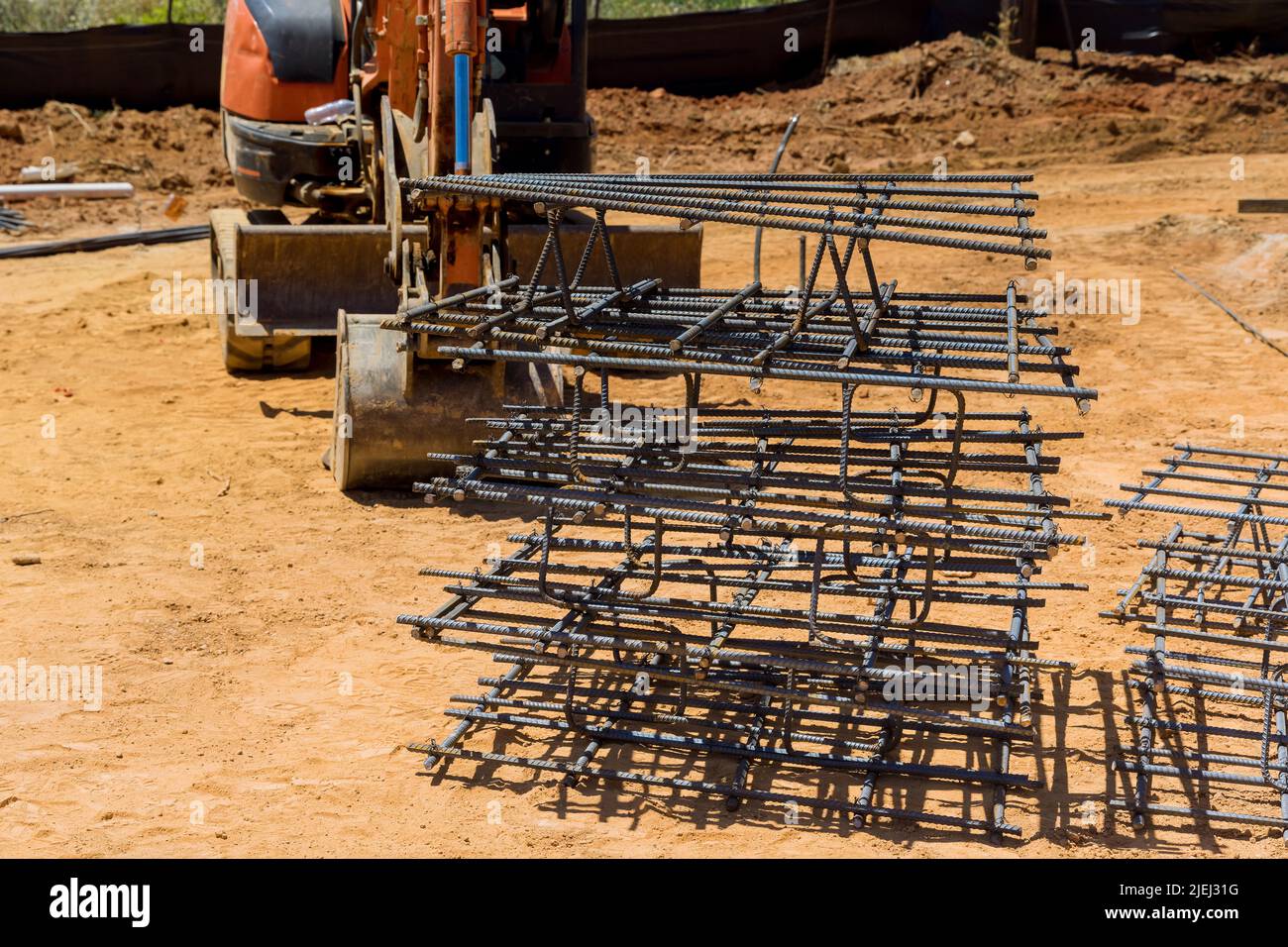 Work on rebar tie wires at reinforced concrete buildings Stock Photo