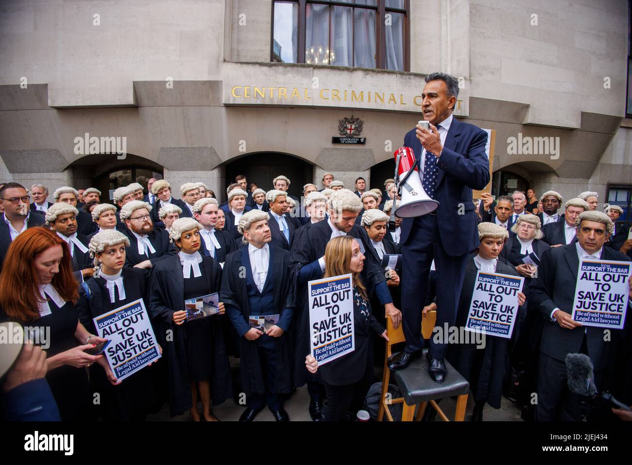 London, UK. 27th June, 2022. Joe Sidhu QC, Leading Criminal Barrister, gives a speech outside the Old Bailey. Barristers and Lawyers gather at the Central Criminal Court (Old Bailey)to strike over low pay and poor conditions. They will hold aseries of strikes over the coming weeks. Credit: Karl Black/Alamy Live News Stock Photo