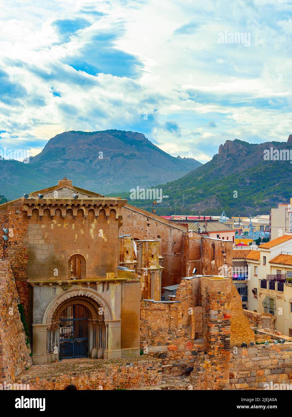 Cityscape with mountains and colorful houses in background, Cartagena, Spain Stock Photo