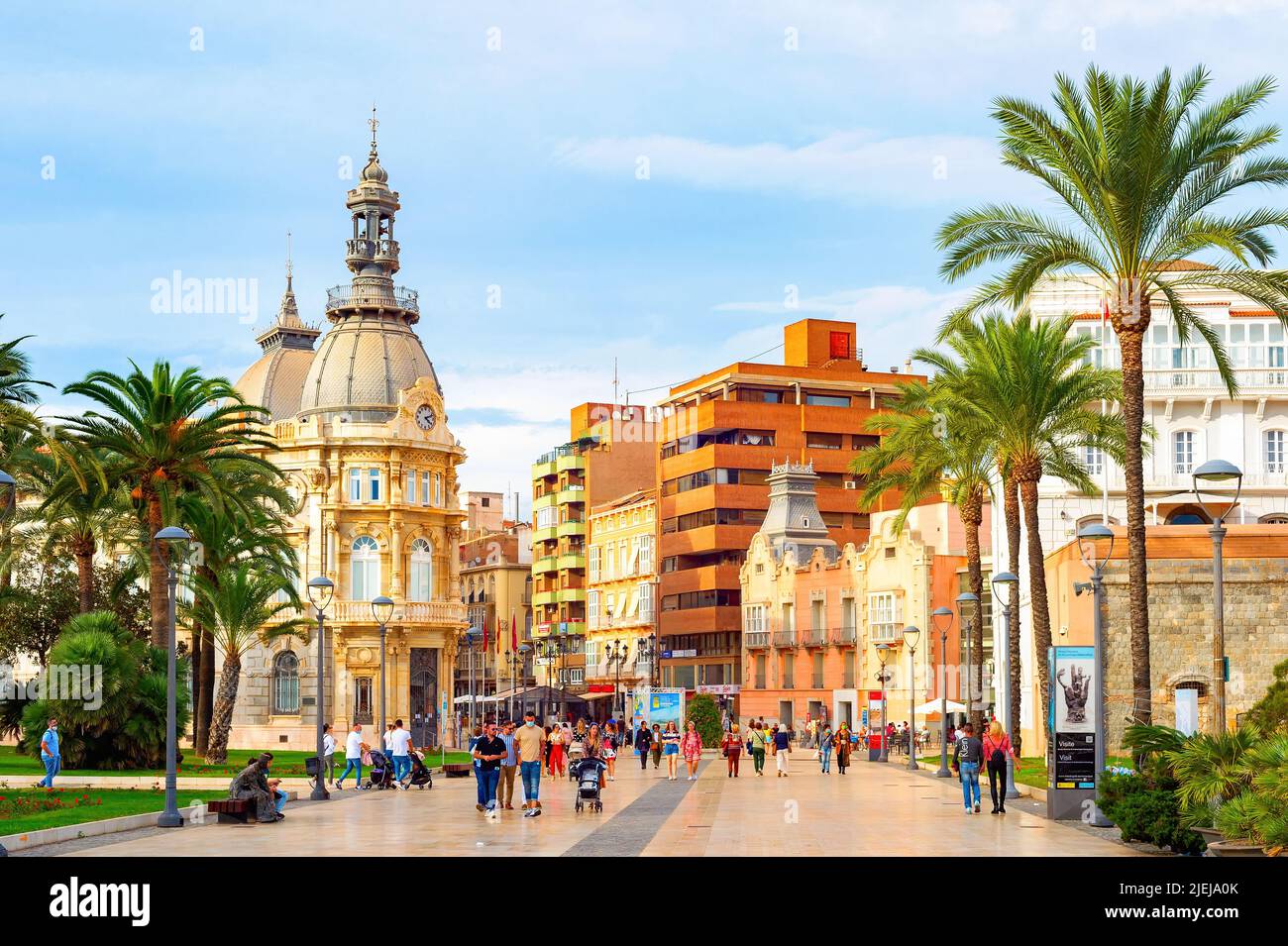 CARTAGENA, SPAIN - NOVEMBER 1, 2021: Tourists walking by city center, colonial architecture, Municipality of Cartagena Stock Photo