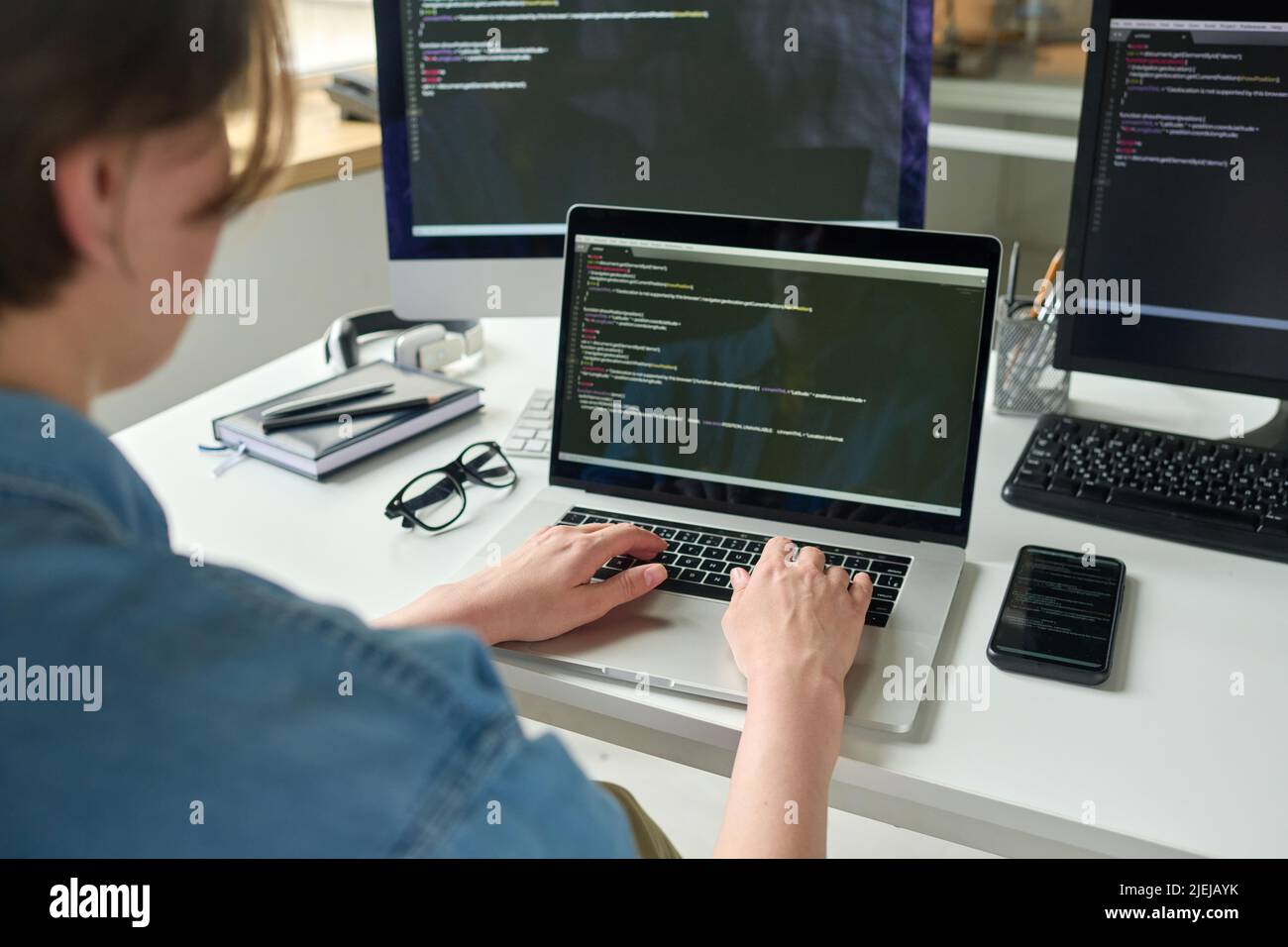 Close-up of developer programming software using computer while working ...