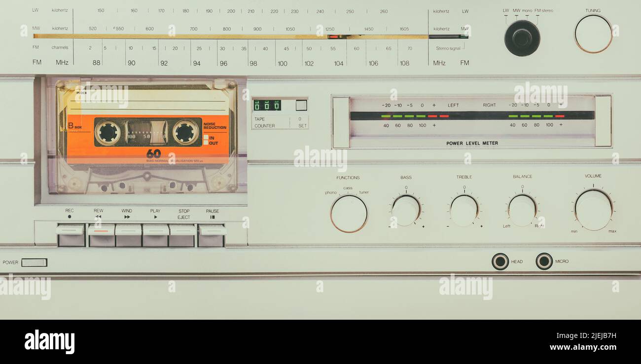 Retro styled image of a vintage silver audio system with cassette player, radio and amplifier Stock Photo