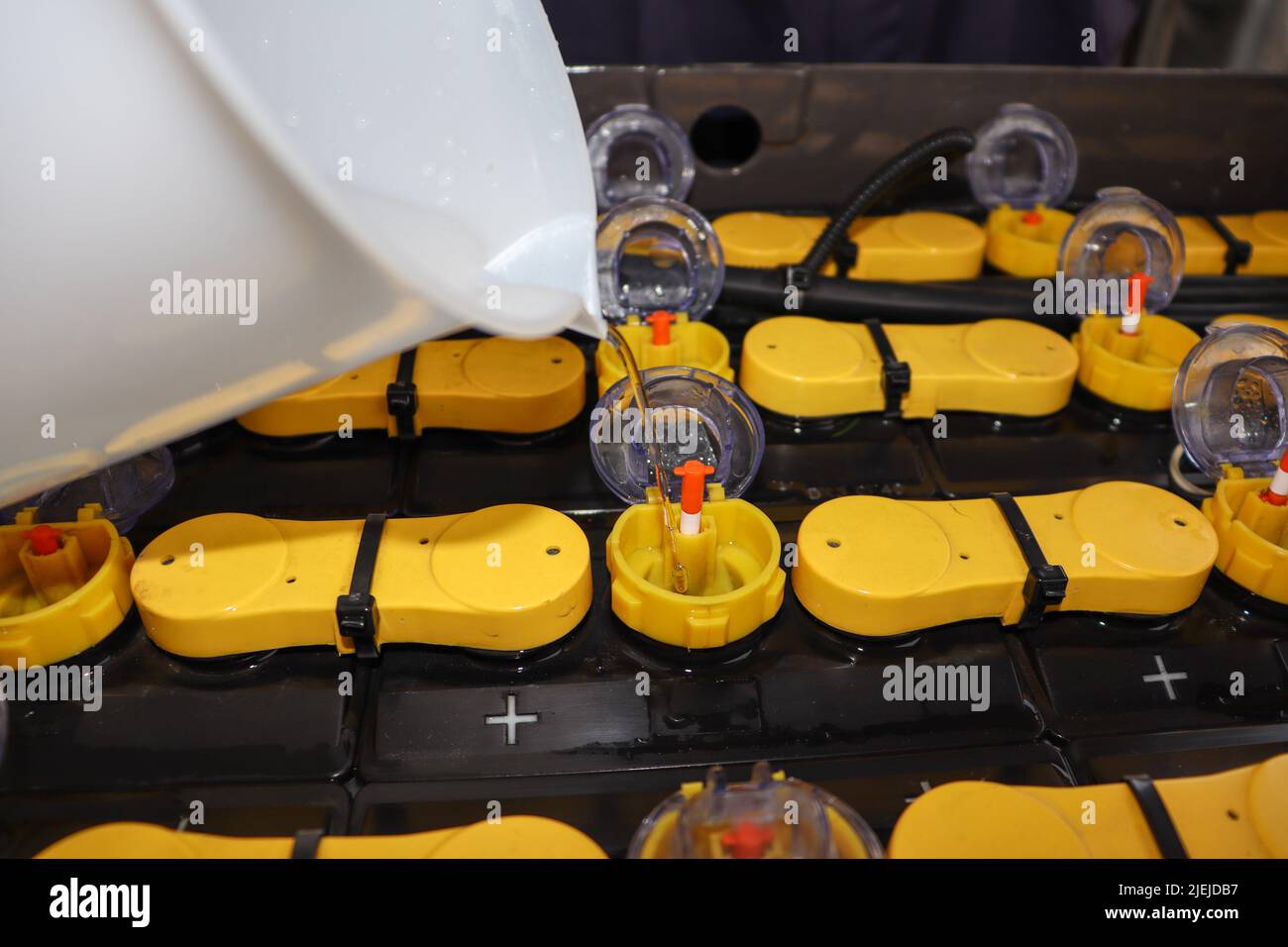 Adjust the battery distilled water level Stock Photo Alamy