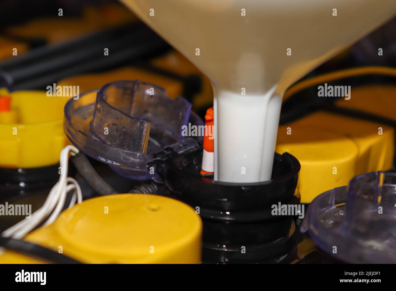 Adjust the battery distilled water level Stock Photo Alamy