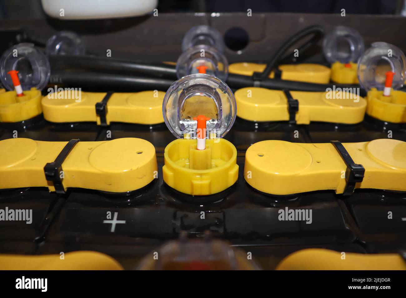 Adjust the battery distilled water level Stock Photo Alamy