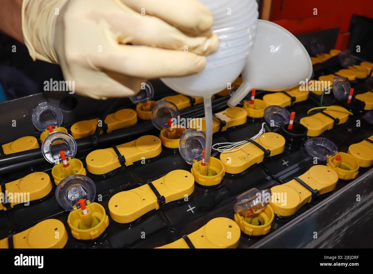 Adjust the battery distilled water level Stock Photo Alamy