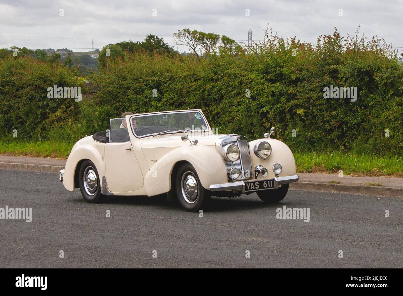 1947 forties 40s cream Triumph 1776cc sports car; en-route to Hoghton Tower for the Supercar Summer Showtime car meet which is organised by Great British Motor Shows in Preston, UK Stock Photo