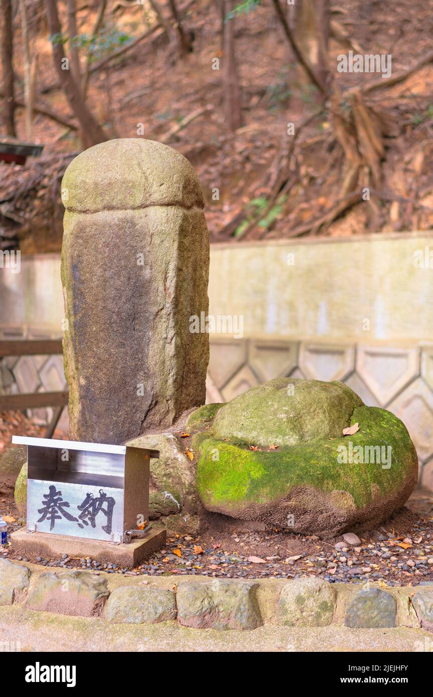 kyushu, japan - december 08 2021: Japanese inyou stone meaning yin and yang stones shaped like the genitals of men and women lined up side by side in Stock Photo