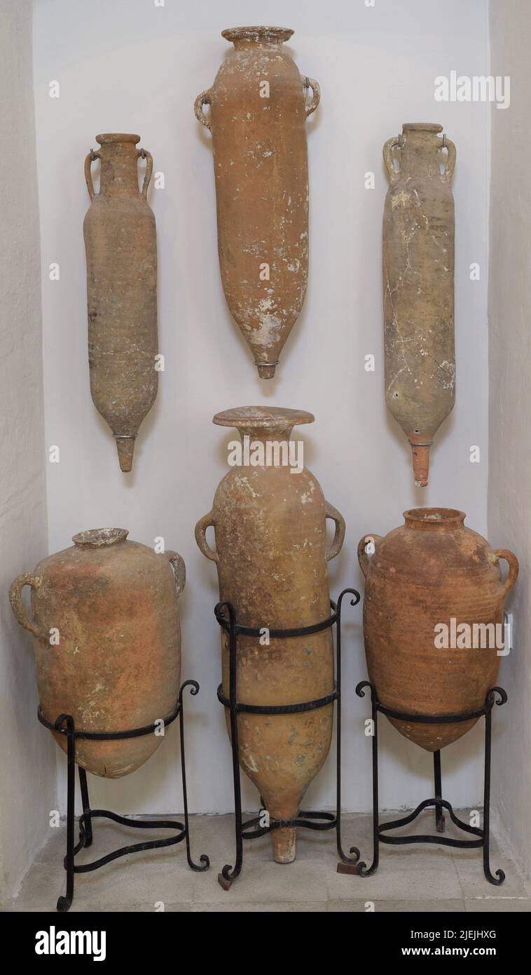 Late Roman Period. Four North African cylindrical amphorae (used between 3rd to 6th century AD) and two from the Maltese Islands, with low handles on shoulders and rounded bases. Found in 1961 from the site of a 5th century AD shipwreck at the mouth of Xlendi Bay (island of Gozo, Malta). Gozo Museum of Archaeology. Cittadela of Victoria in Gozo. Malta. Stock Photo