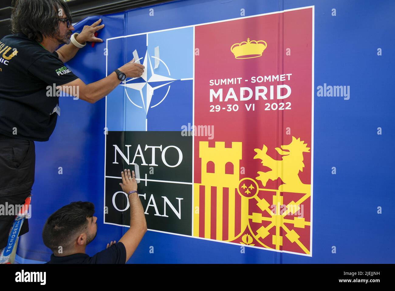 Workers put up signage outside the Madrid Fair, venue for the upcoming NATO Summit in Madrid, Spain, June 27, 2022. Spain will host a two-day NATO summit starting June 29.   Photo by Paul Hanna/UPI Stock Photo