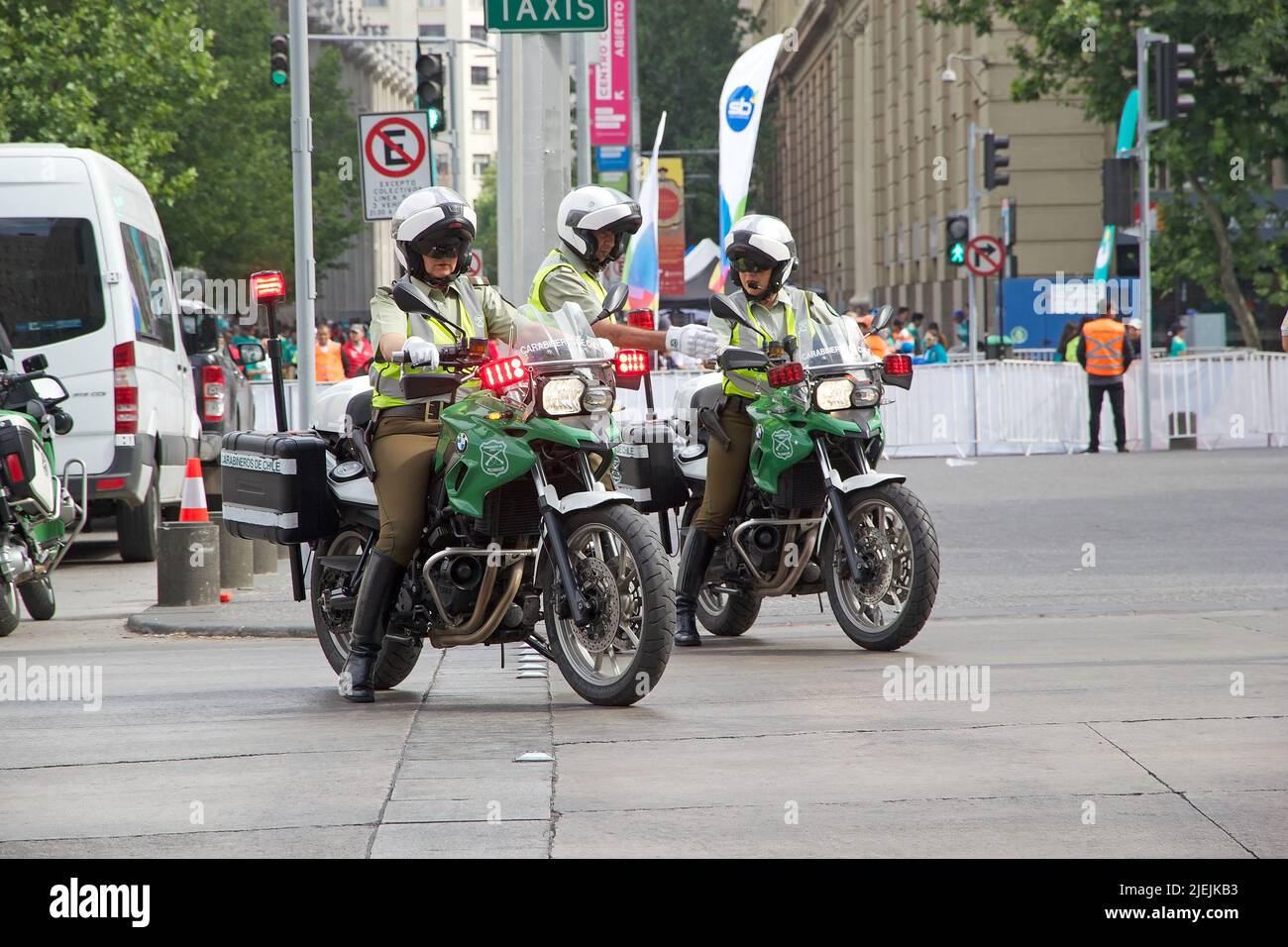 Carabiniers Of Chile Are Riding A Motorcycles Along The Street In Siantiago Chile Carabiniers Carabiniers Of Chile Are Riding A Motorcycles Along The Street In Siantiago Chile Carabiniers