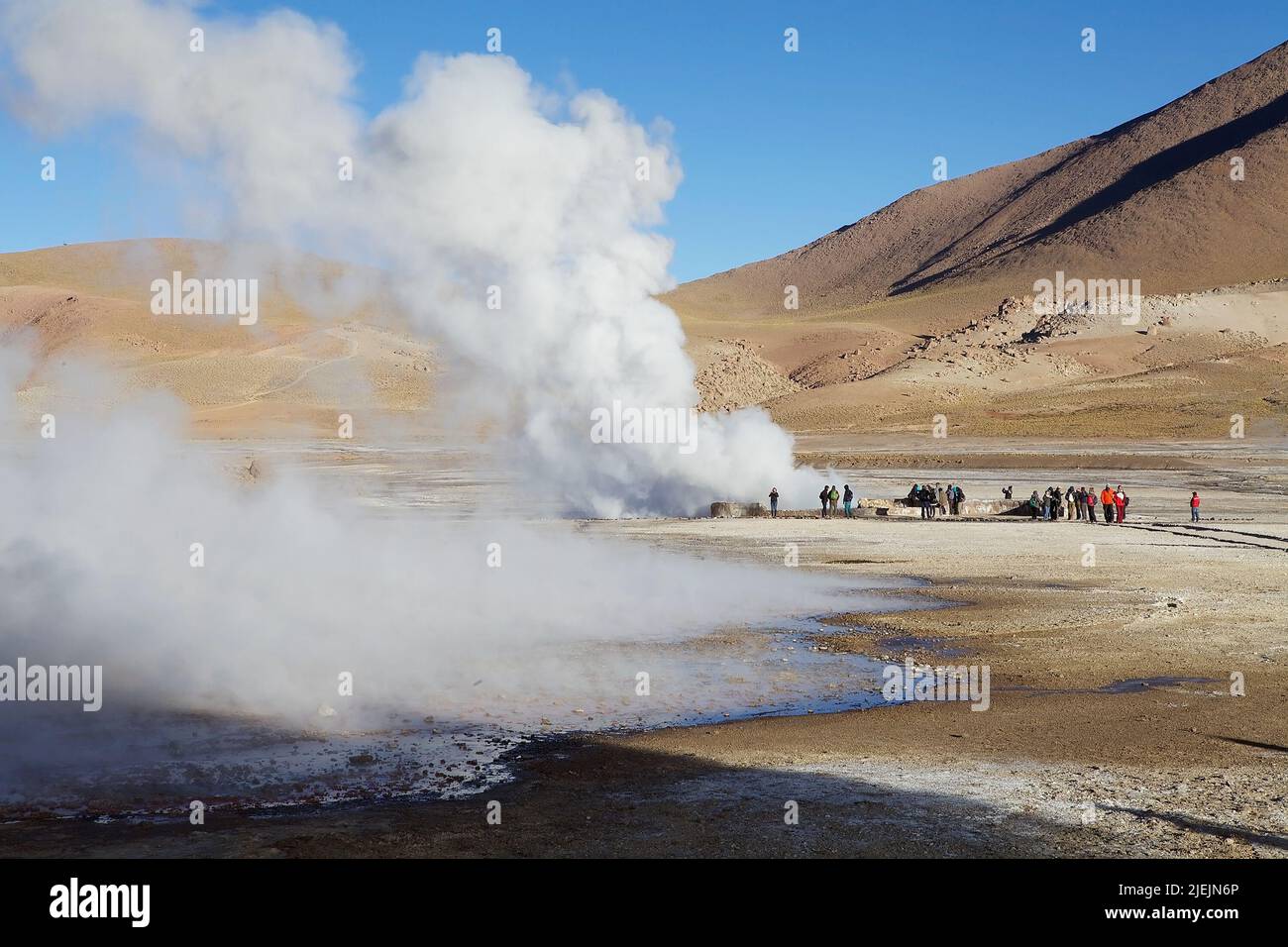 Tourists are visiting the El Tatio geysers, Chile. El Tatio is a geyser ...