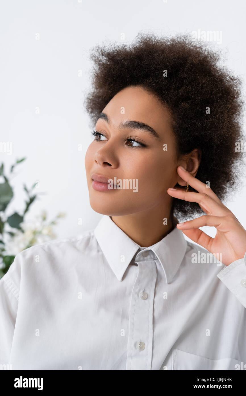 portrait of dreamy african american woman in white shirt with collar Stock Photo