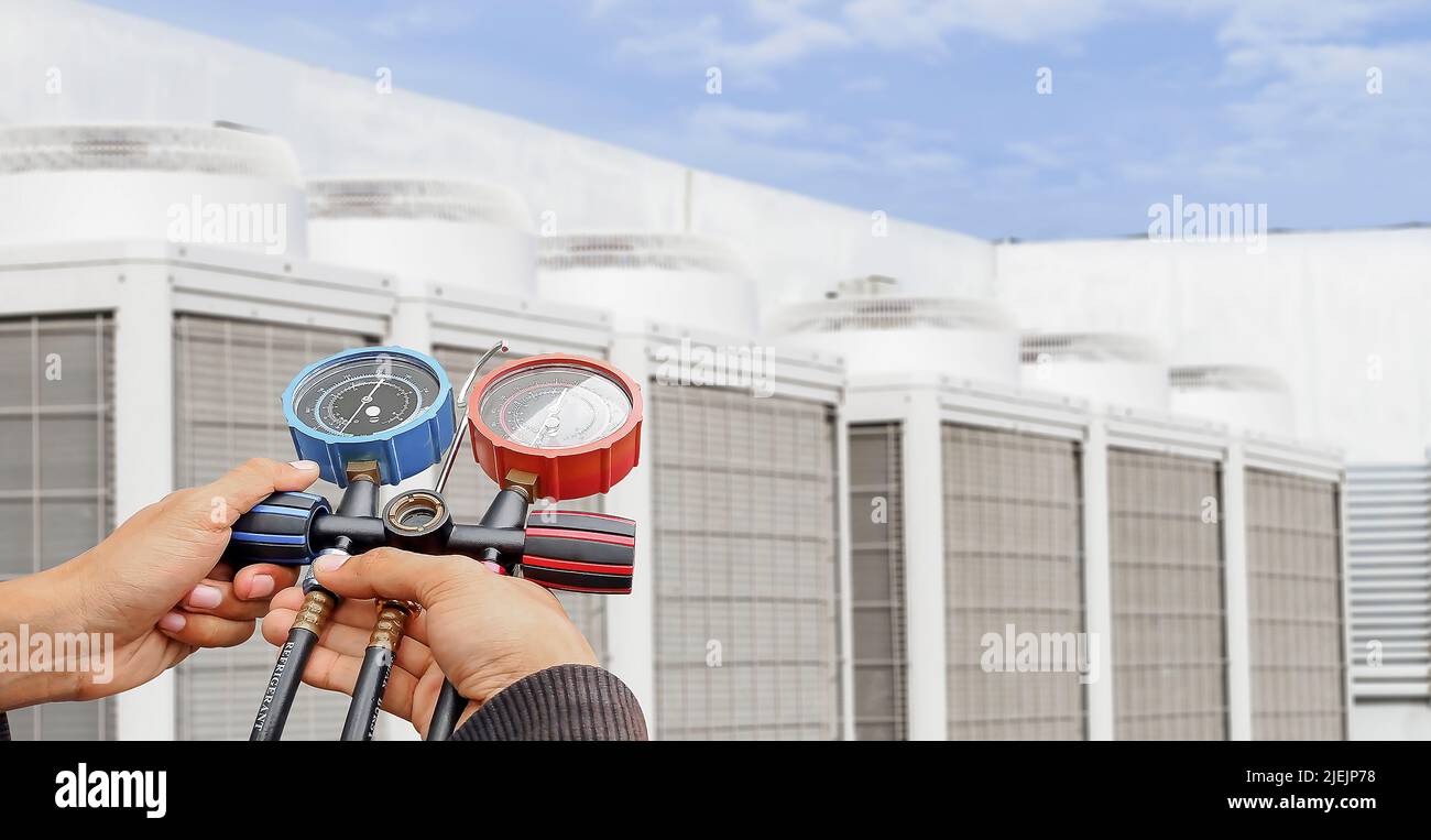 Technician checking the operation of the air conditioner Stock Photo ...