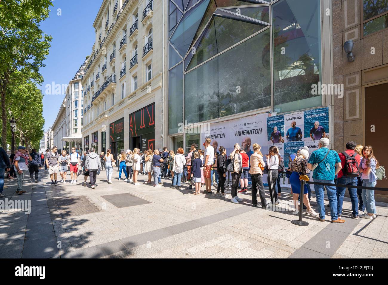 Paris, France - June 27, 2022: People queuing outside Stranger Things Pop-Up store on avenue Champs Elysees Stock Photo