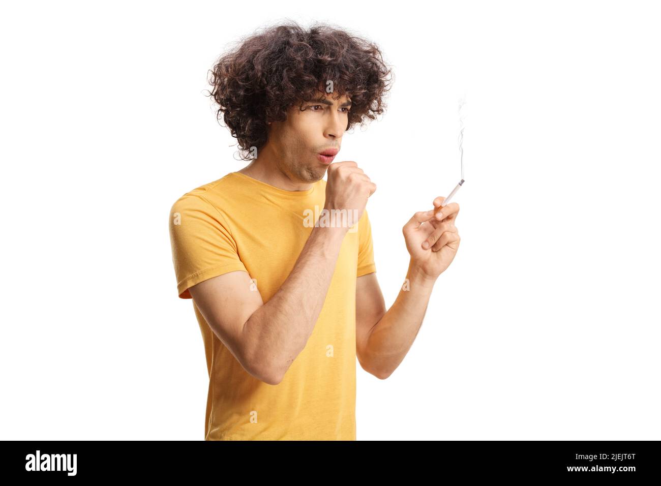 Young man smoking and coughing isolated on white background Stock Photo