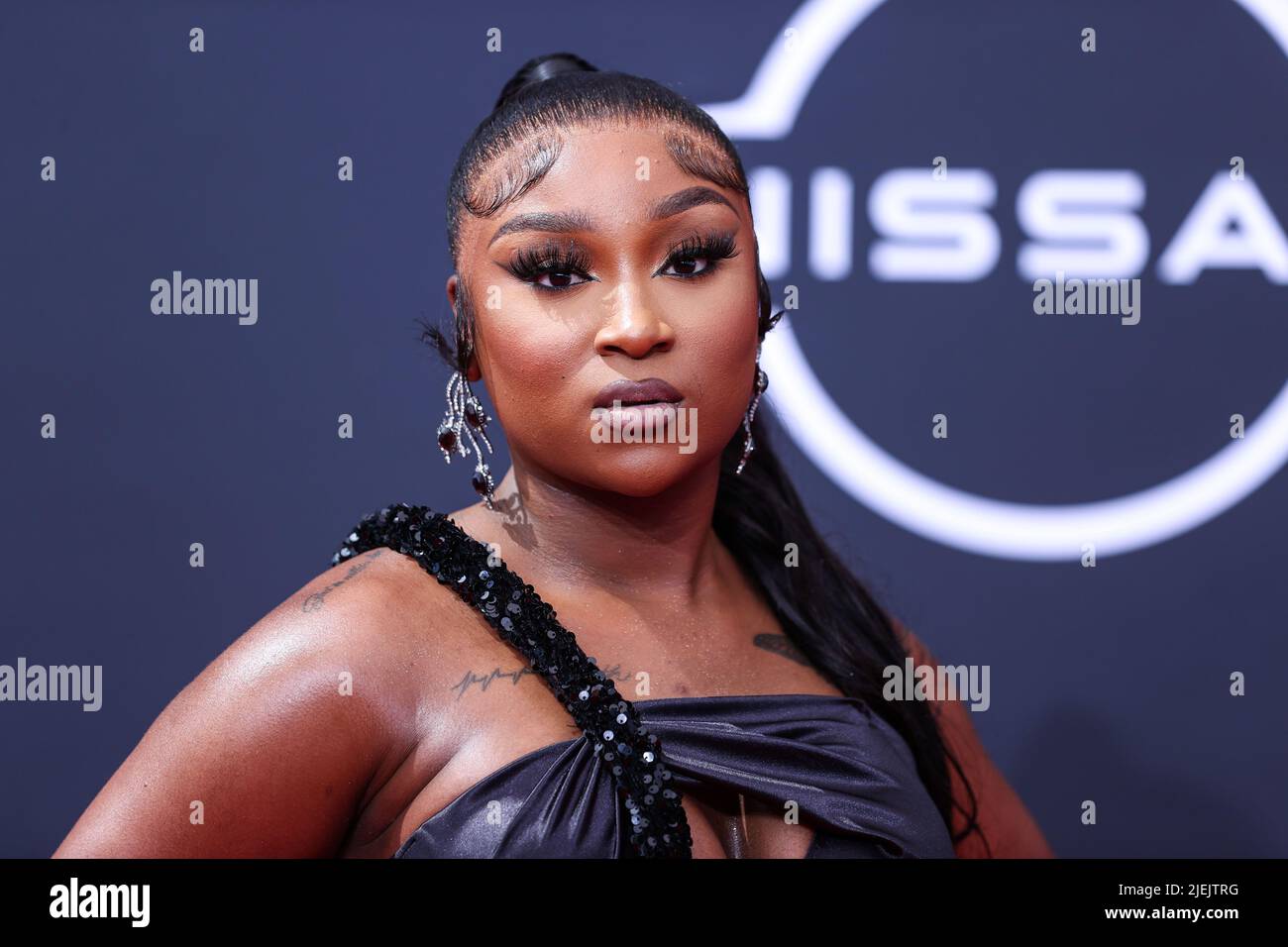 LOS ANGELES, CALIFORNIA, USA JUNE 26 Erica Banks arrives at the BET