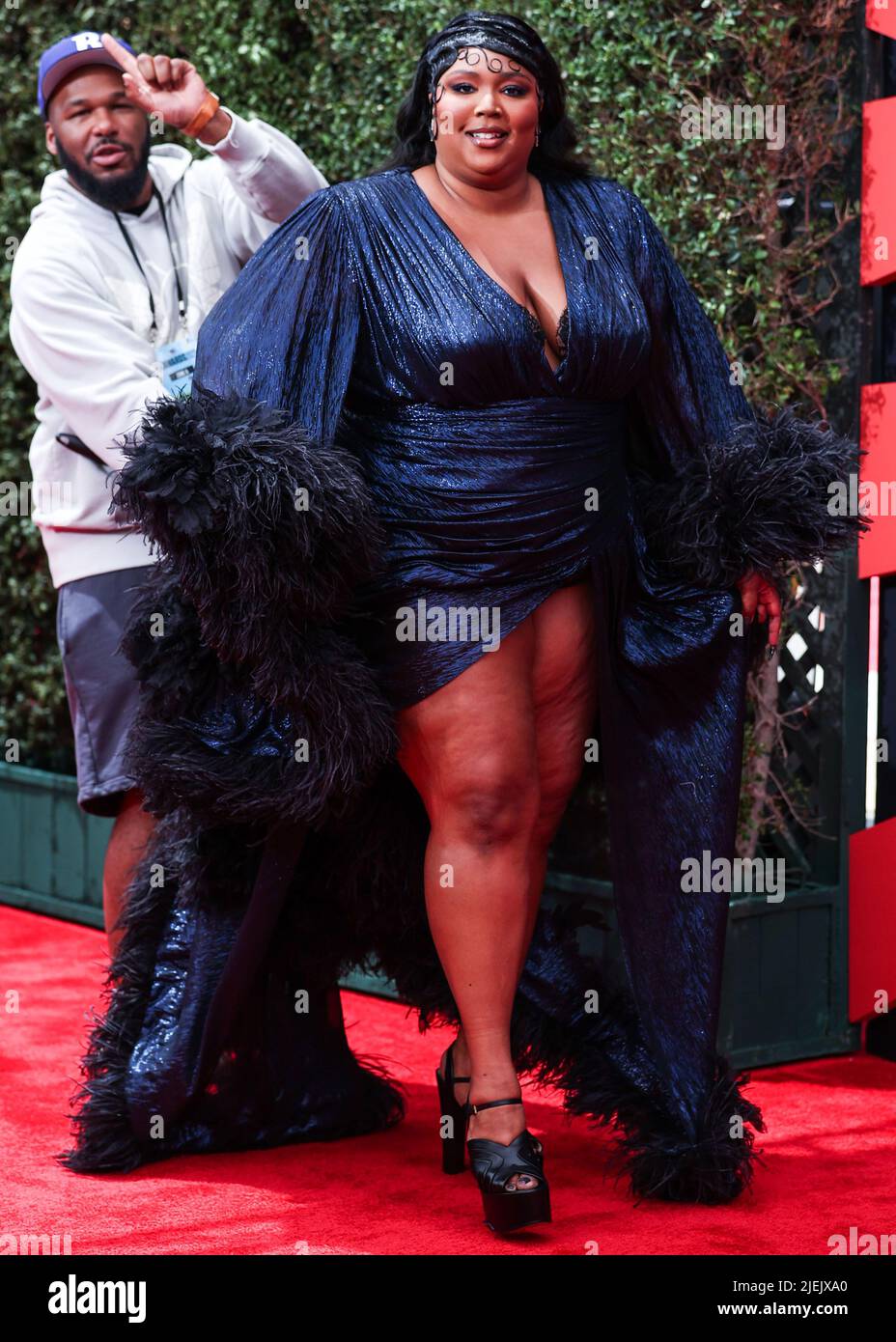LOS ANGELES, CALIFORNIA, USA - JUNE 26: American singer Lizzo wearing a custom Gucci feathered gown arrives at the BET Awards 2022 held at Microsoft Theater at L.A. Live on June 26, 2022 in Los Angeles, California, United States. (Photo by Xavier Collin/Image Press Agency) Credit: Image Press Agency/Alamy Live News Stock Photo