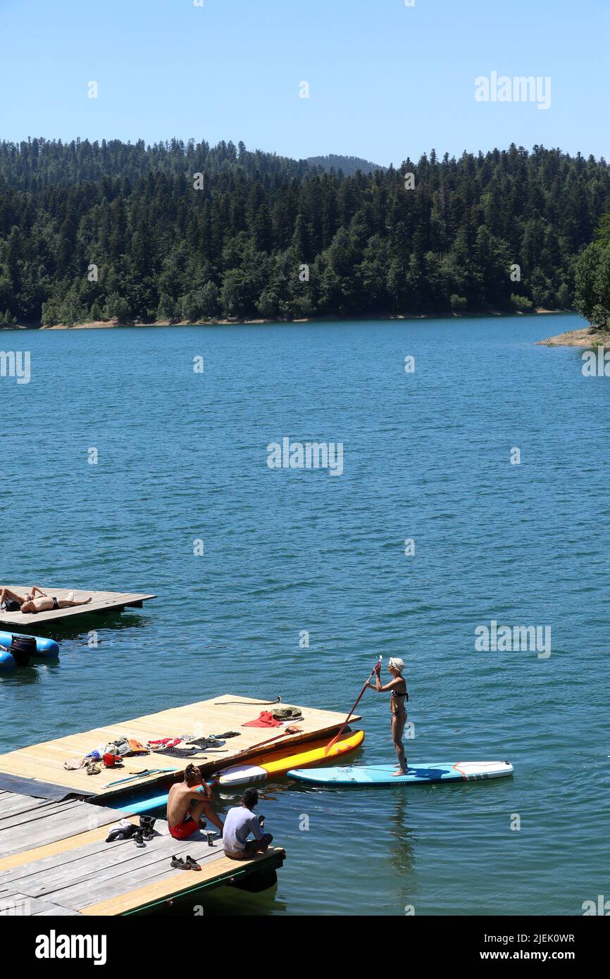 Rijeka, Croatia. 27th June, 2022. Citizens enjoy the beach Njupac by  Lokvarsko Lake in Lokve, Croatia