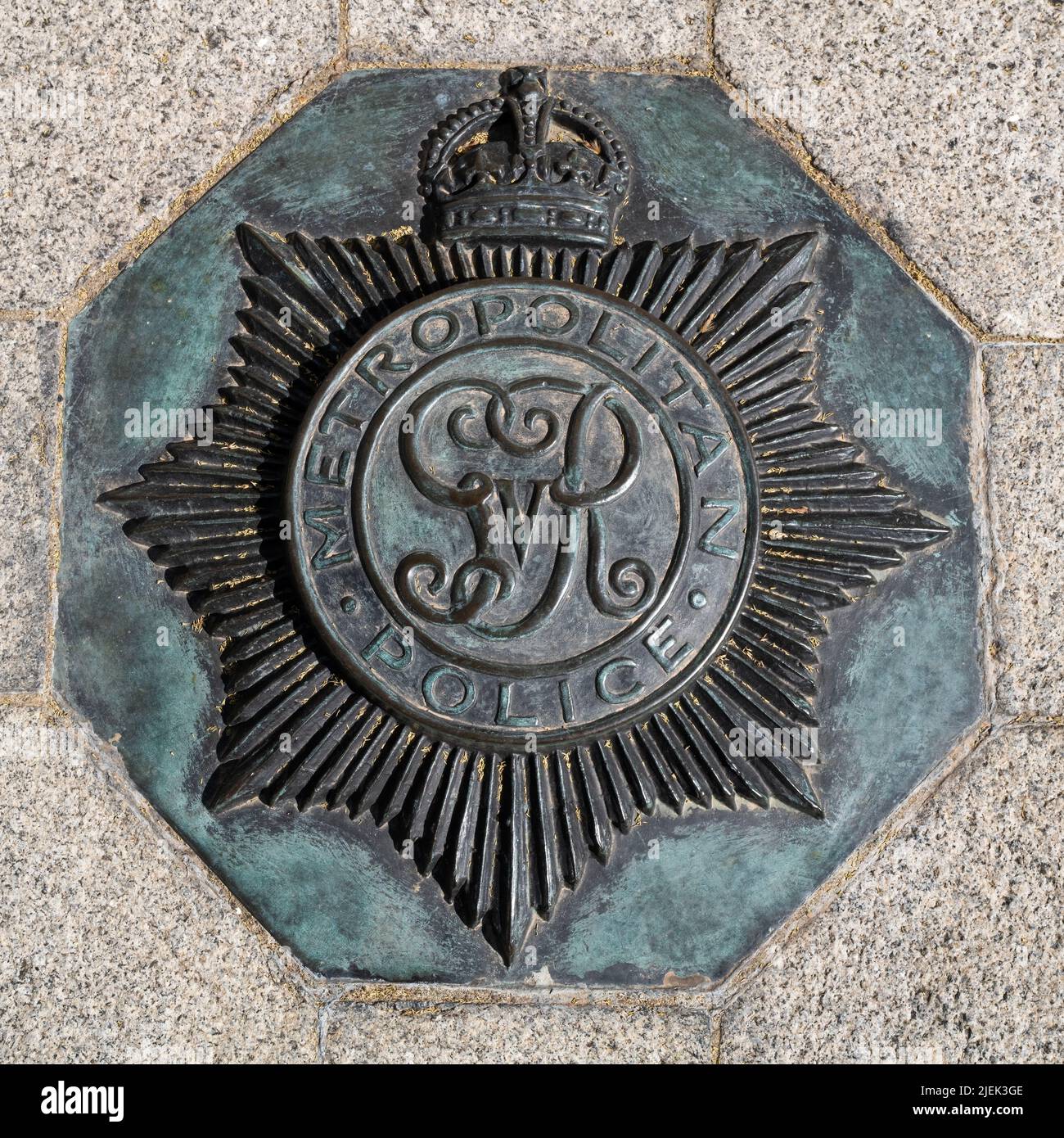 London, UK - 16th April 2022: Crown emblam for the Metropolitan Police service, embedded in the pavement outside of the New Scotland Yard building, Vi Stock Photo