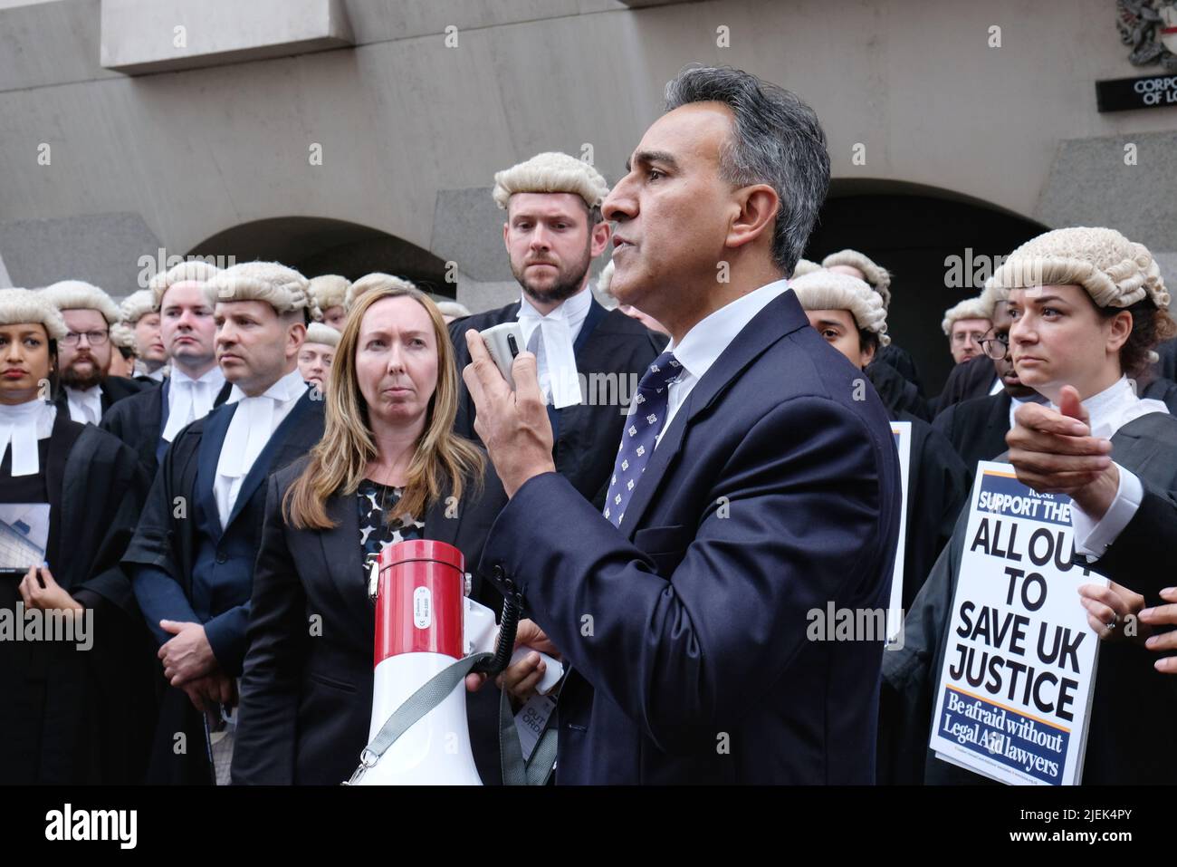 London, UK, 27th June, 2022. Chairman of the Criminal Bar Association Jo Sidhu QC addresses the crowd assembled outside the Central Criminal Court as criminal barristers across England and Wales begin strike action over legal aid payments. Hundreds of joined the picket outside the Central Criminal Court, also known as the Old Bailey in strike action today and tomorrow this week, and set to continue for the next four weeks. Credit: Eleventh Hour Photography/Alamy Live News Stock Photo