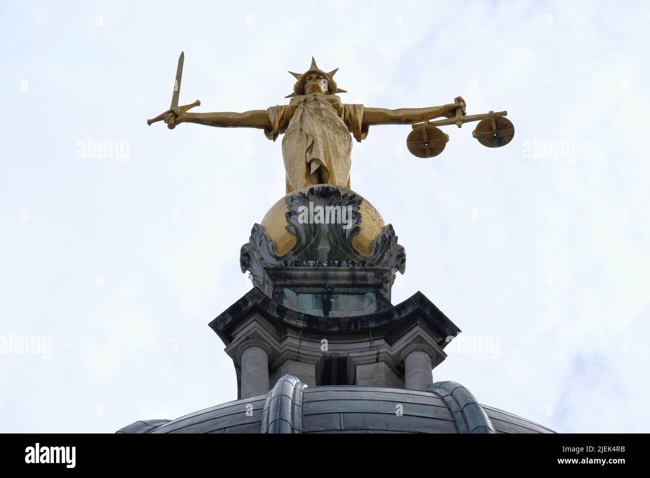 London, UK, 27th June, 2022. The Statue of Justice stands over the Old Bailey as criminal barristers across England and Wales begin strike action over legal aid payments. Hundreds of barristers and solicitors joined the picket outside the Central Criminal Court in strike action today and tomorrow this week.  Credit: Eleventh Hour Photography/Alamy Live News Stock Photo