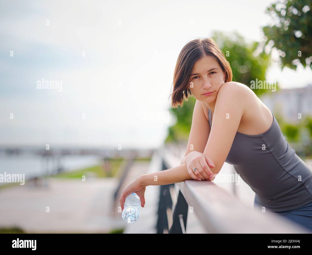 asian young strong, confident woman in sportive clothes feeling bad about to throw up