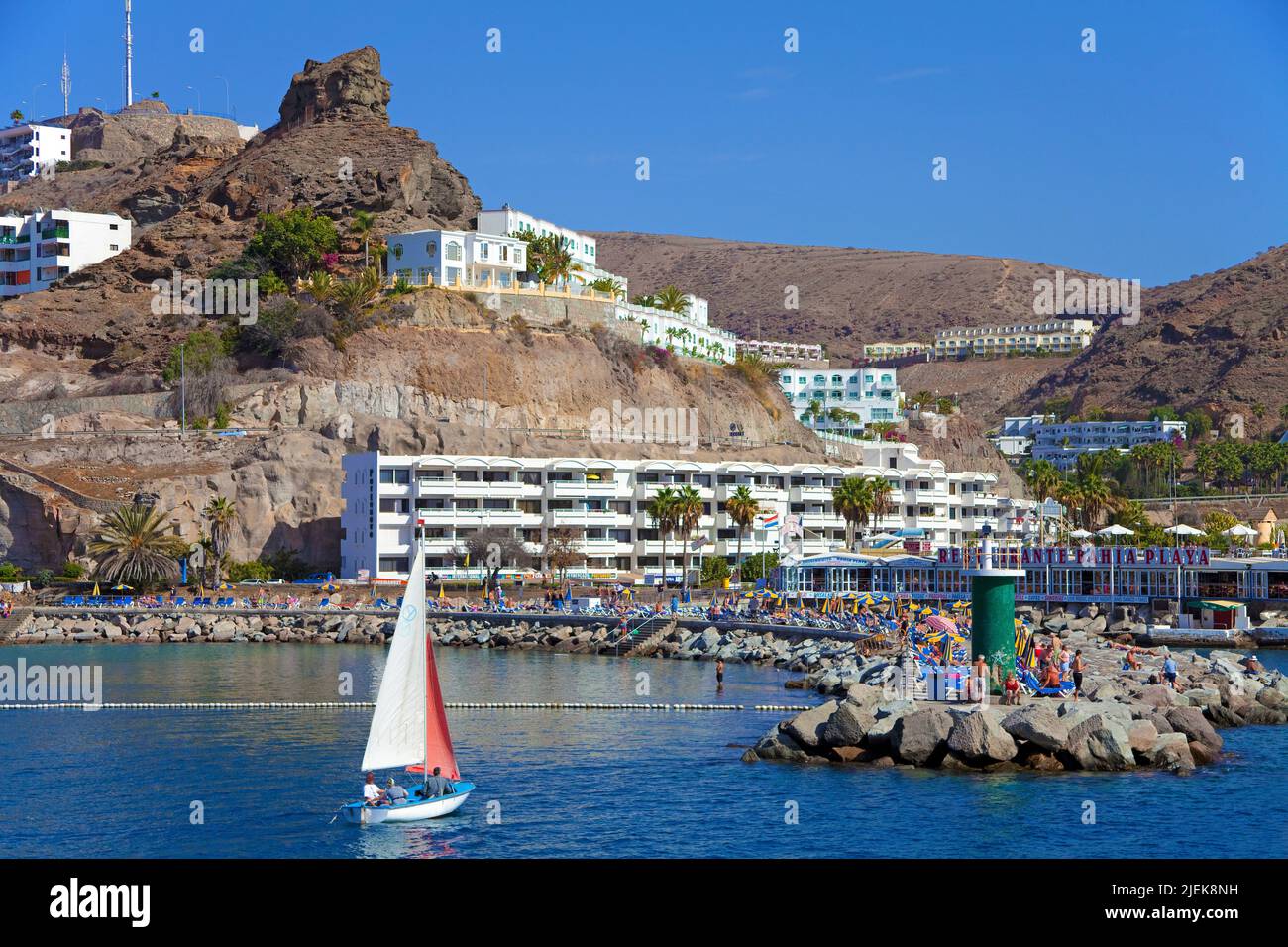 Sailing boat at the harbour entrance of Puerto Rico, Grand Canary, Canary islands, Spain, Europe Stock Photo