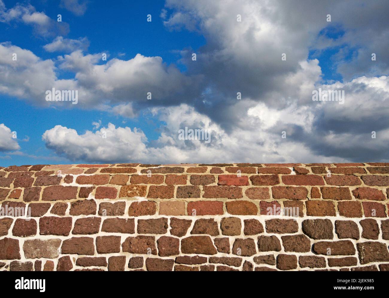 stone sea wall and cloudy sky Stock Photo