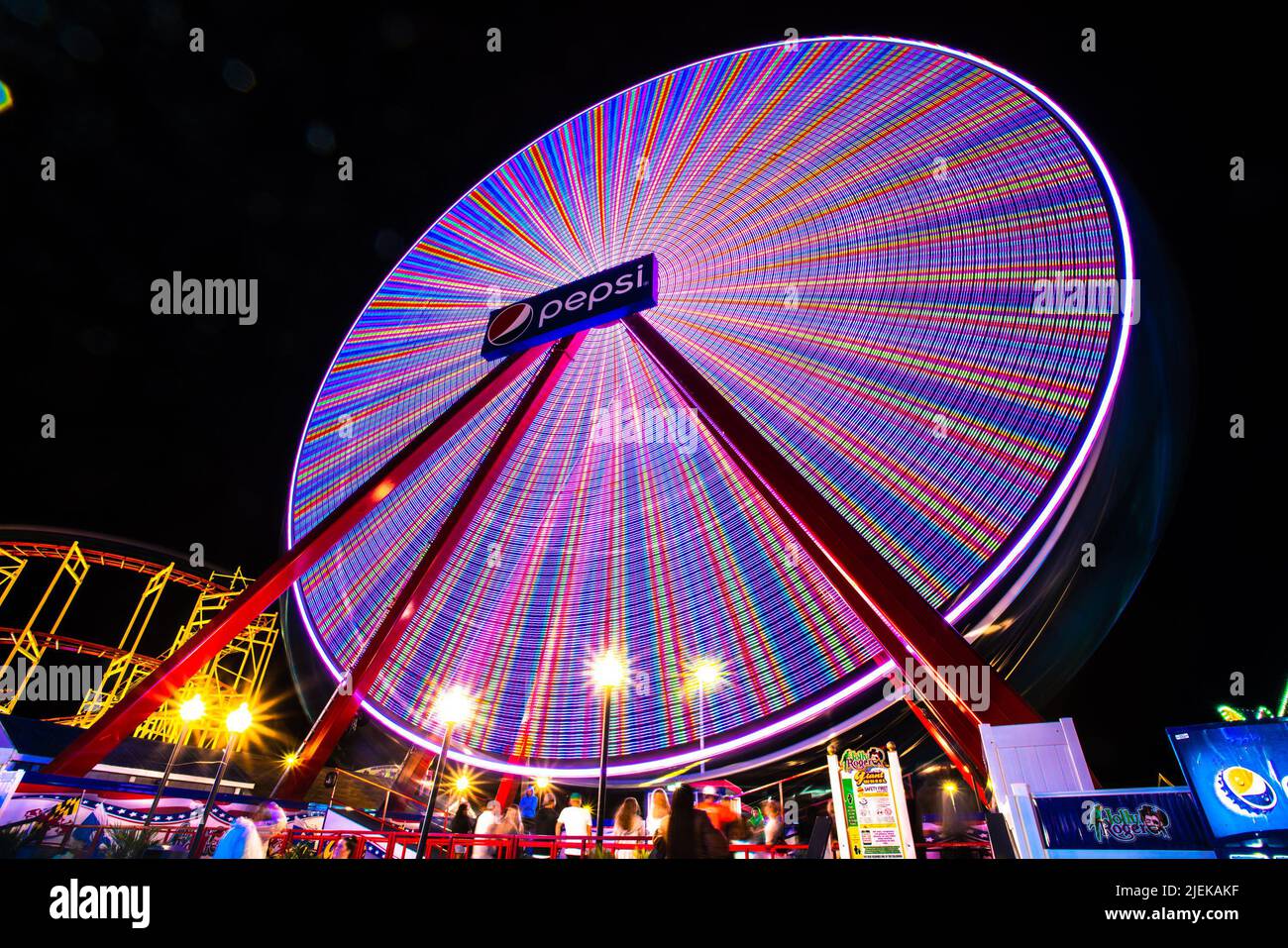 Ocean City, Maryland, USA - June 24, 2022:  View of Jolly Roger Amusement park seen from the Ocean City Maryland Boardwalk on a summer night with fun Stock Photo