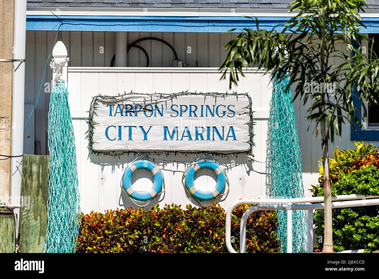 Tarpon Springs, Florida colorful blue white Greek European small town sunny day sign for city marina at harbor with nobody Stock Photo
