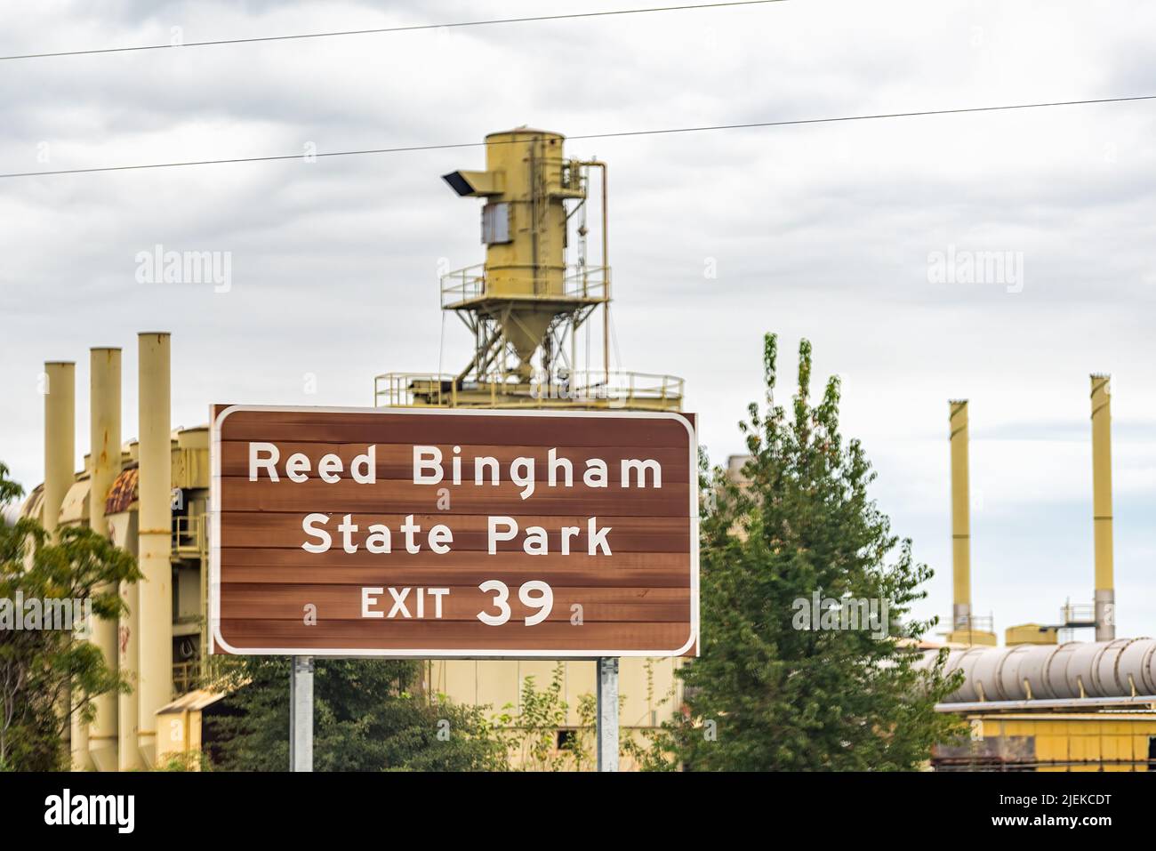 Adel, Georgia on interstate i-75 with sign for Reed Bingham State Park at Exit 39 and background of Sunbelt Industrial Recycling center Stock Photo
