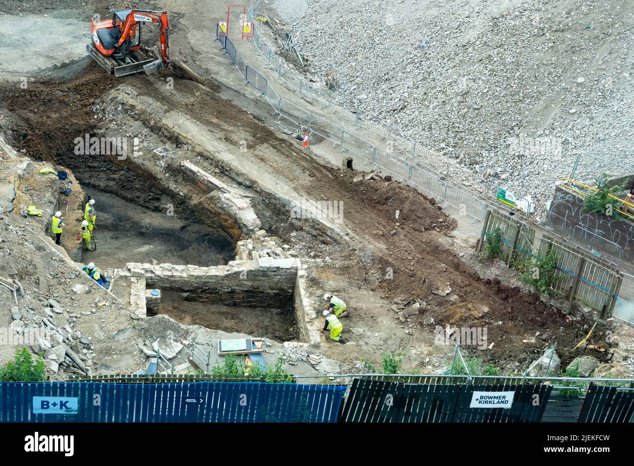 View of archaeologists investigating an excavation site in the city centre of Newcastle upon Tyne, UK, following demolition of buildings. Stock Photo