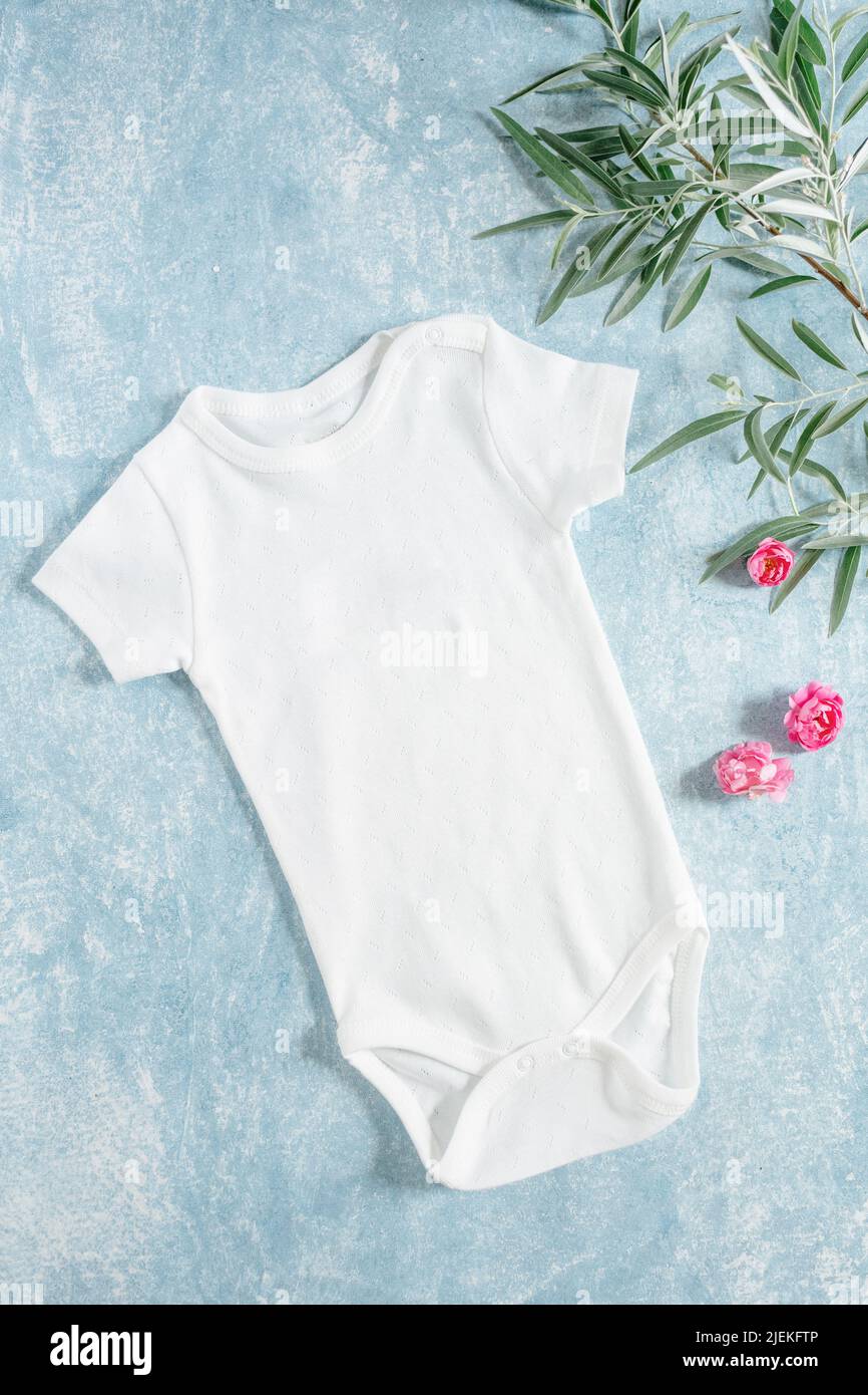 white baby clothes, newborn baby costume mockup Stock Photo Alamy