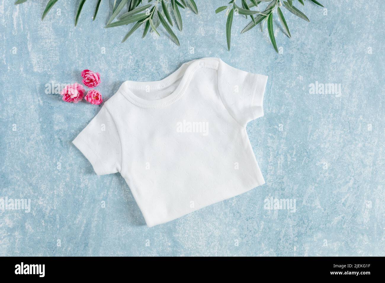 white baby clothes, newborn baby costume mockup Stock Photo Alamy
