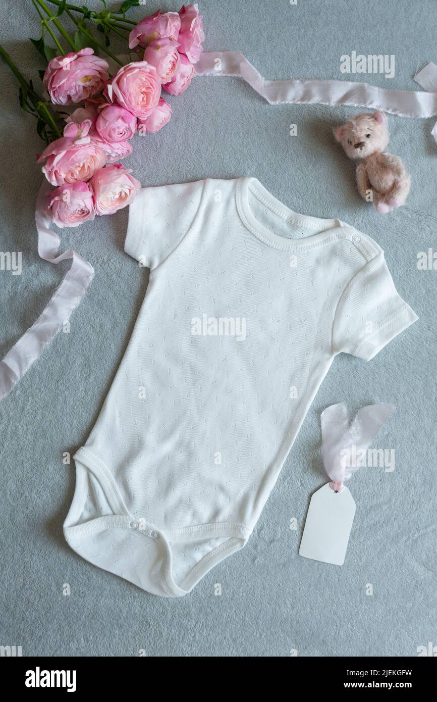 white baby clothes, newborn baby costume mockup Stock Photo