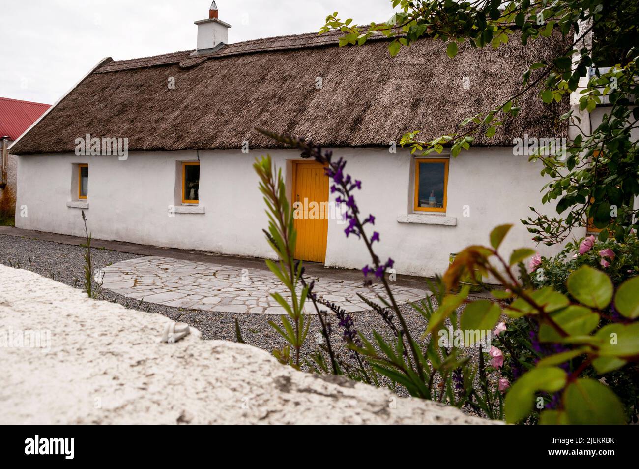 Thatched roof cottage in the seaport village of Kinvara, Ireland Stock
