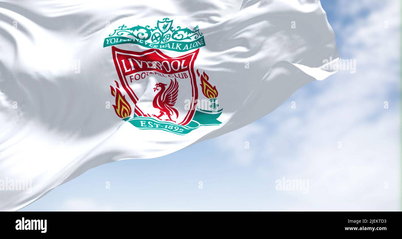 Liverpool, UK, May 2022: The flag of Liverpool Football Club waving in the wind on a clear day. Liverpool F.C. is a professional football club based i Stock Photo