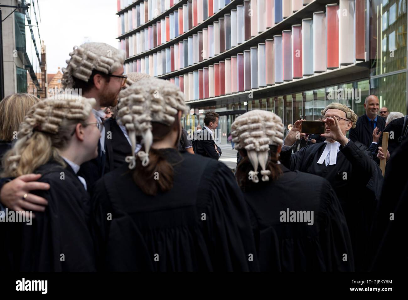 london-uk-27th-june-2022-a-criminal-barrister-takes-a-photo-of-his