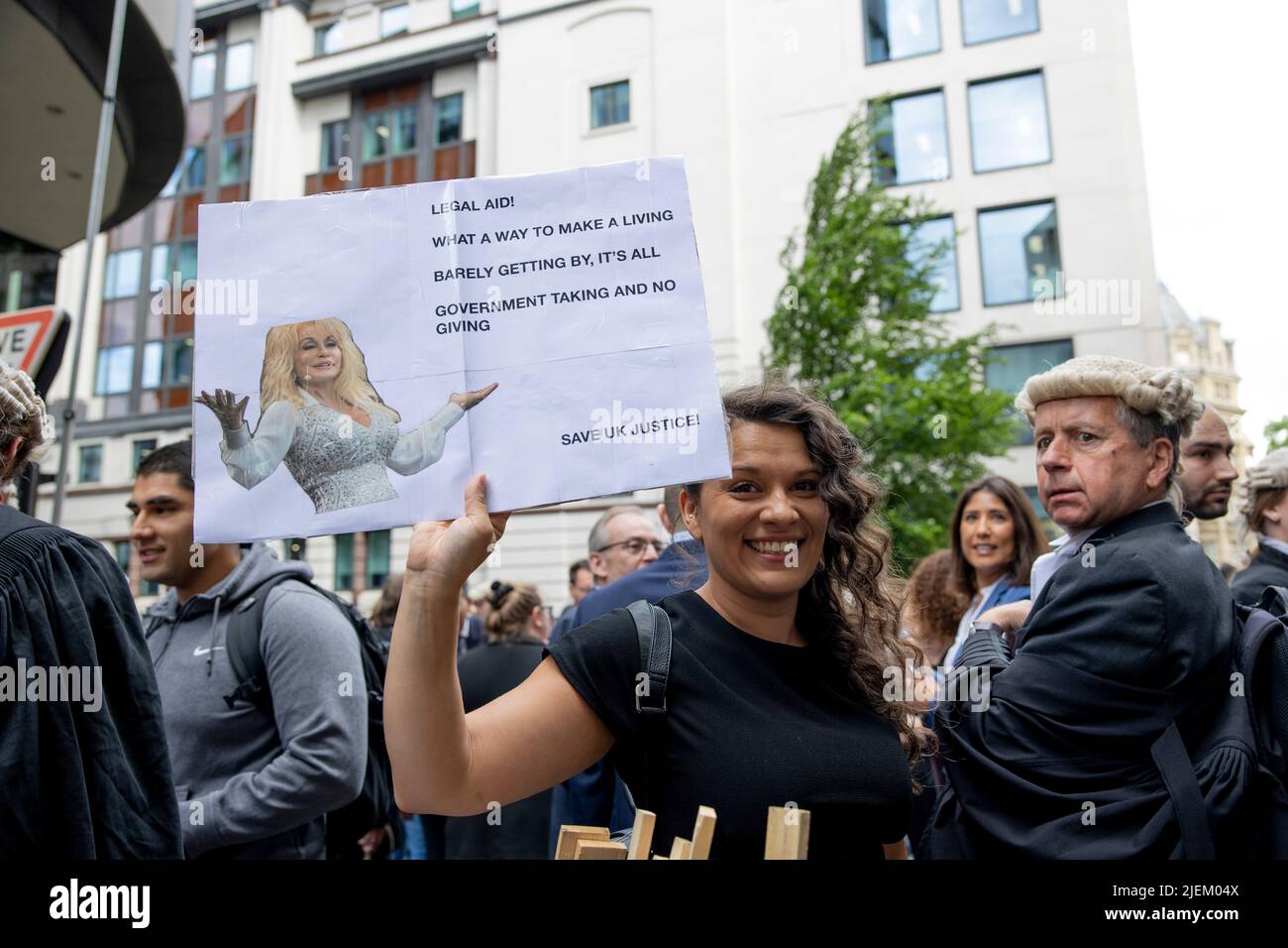 a-junior-criminal-barrister-holds-sign-outside-the-old-bailey-criminal