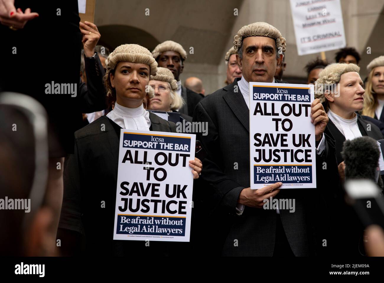 a-group-of-criminal-barristers-hold-placards-outside-the-old-bailey