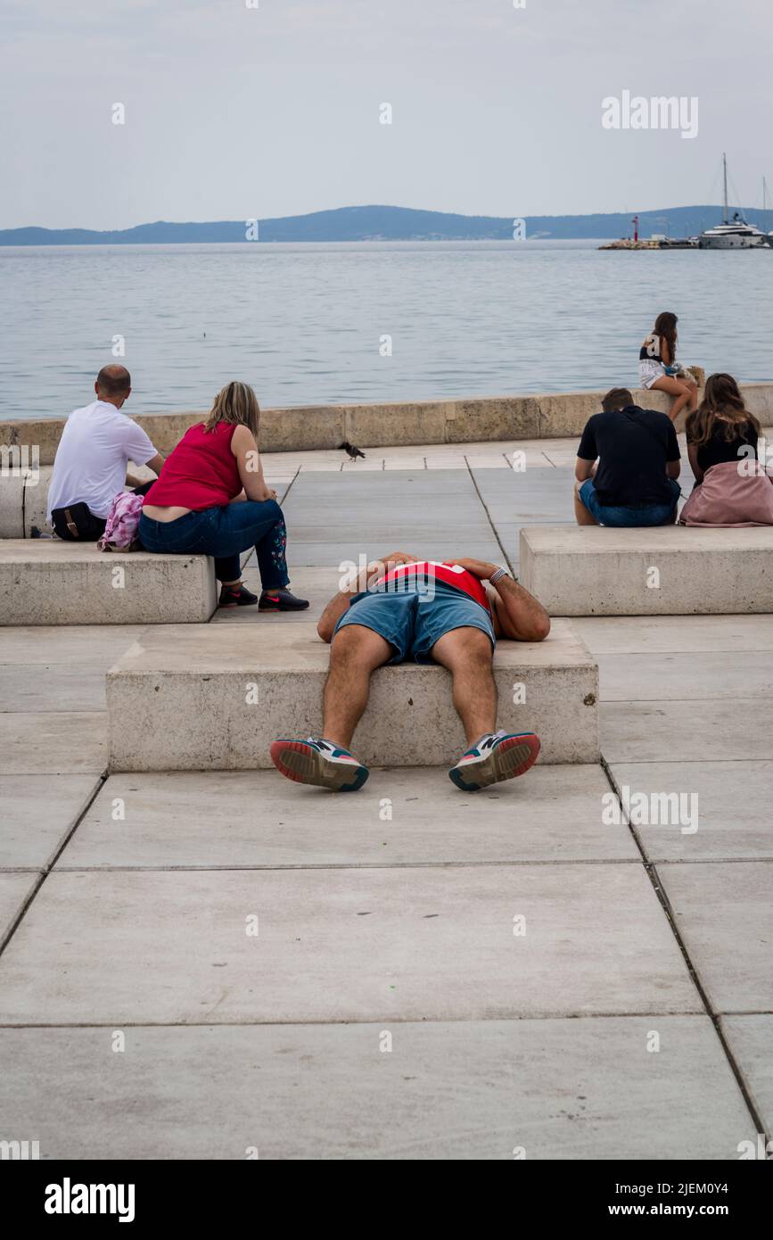 Man resting on the Riva promenade, Split, Croatia Stock Photo